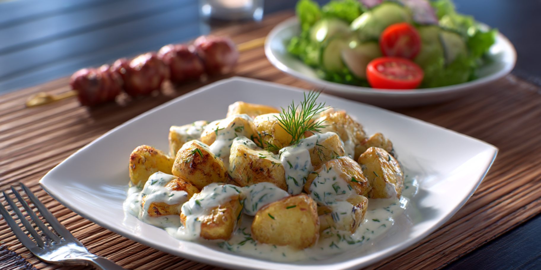 Картопля у сметанному соусі з зеленню