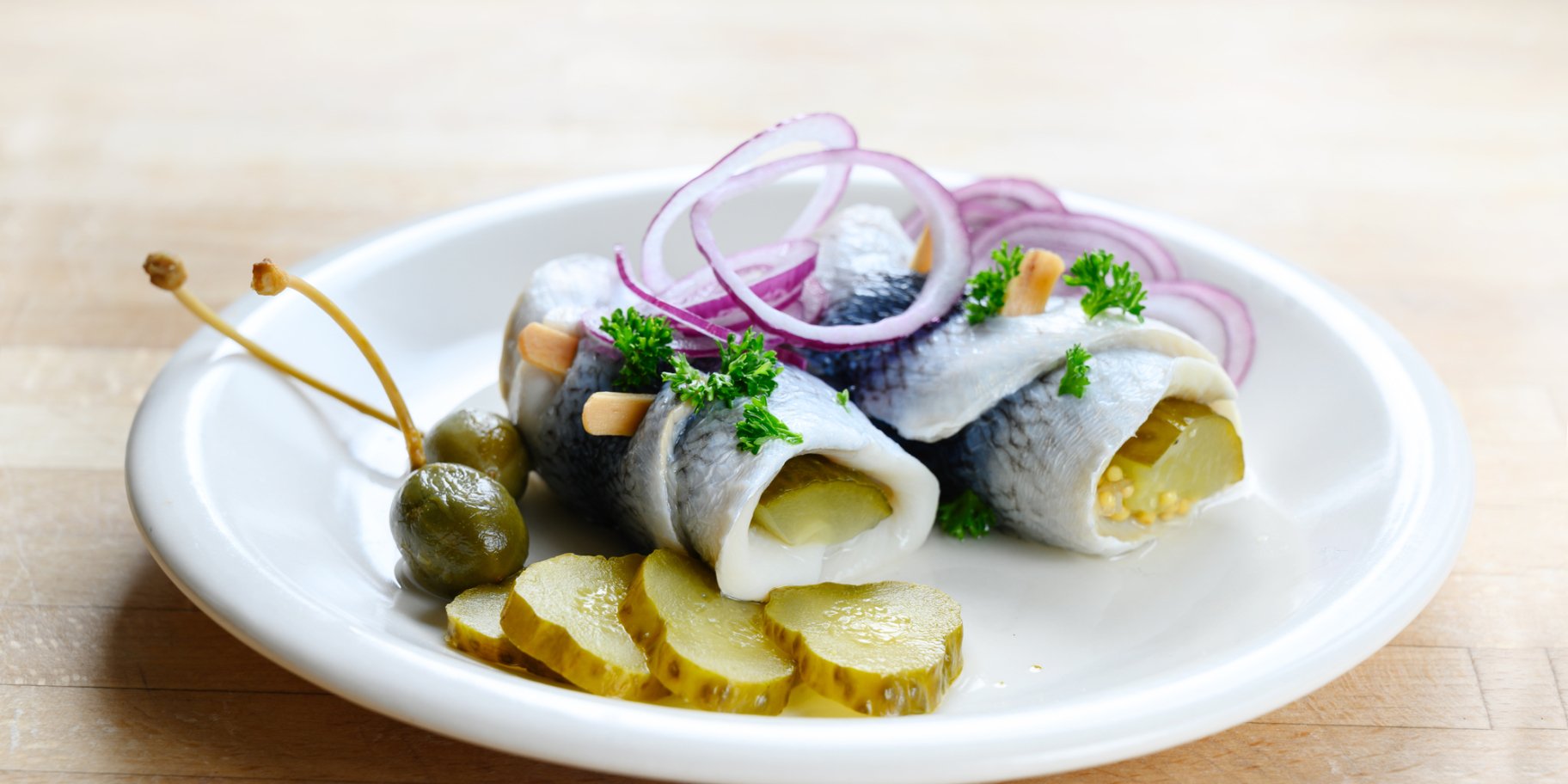 Оселедець з корнішонами