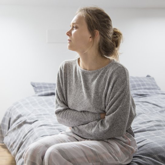 У жінки болить живіт