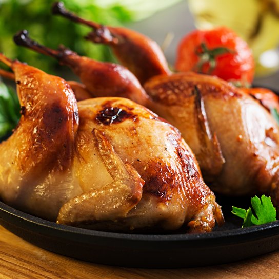 Запечена перепілка, фарширована апельсином