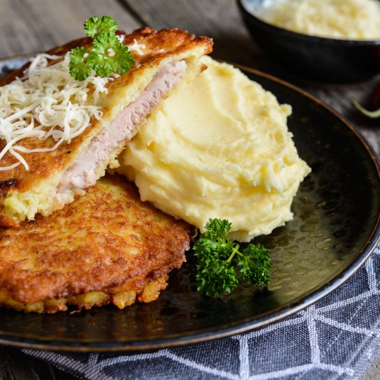 Свиняча відбивна в часниковому клярі